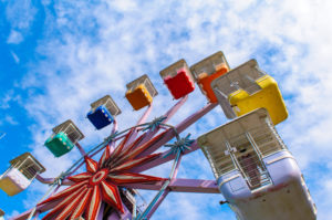colorful ferris wheel in the playground against the blue sky