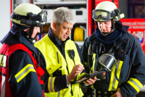 Fire brigade - Squad leader gives instructions to firefighters